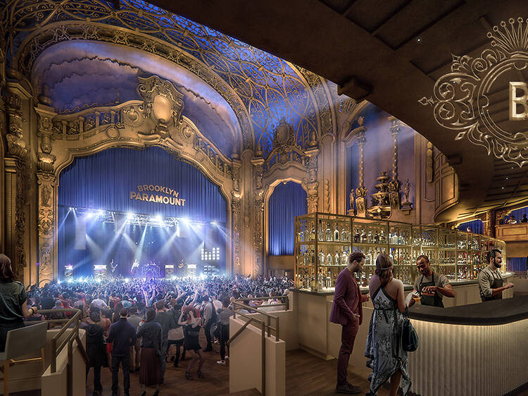 Audience enjoying a live performance inside an intimate music venue